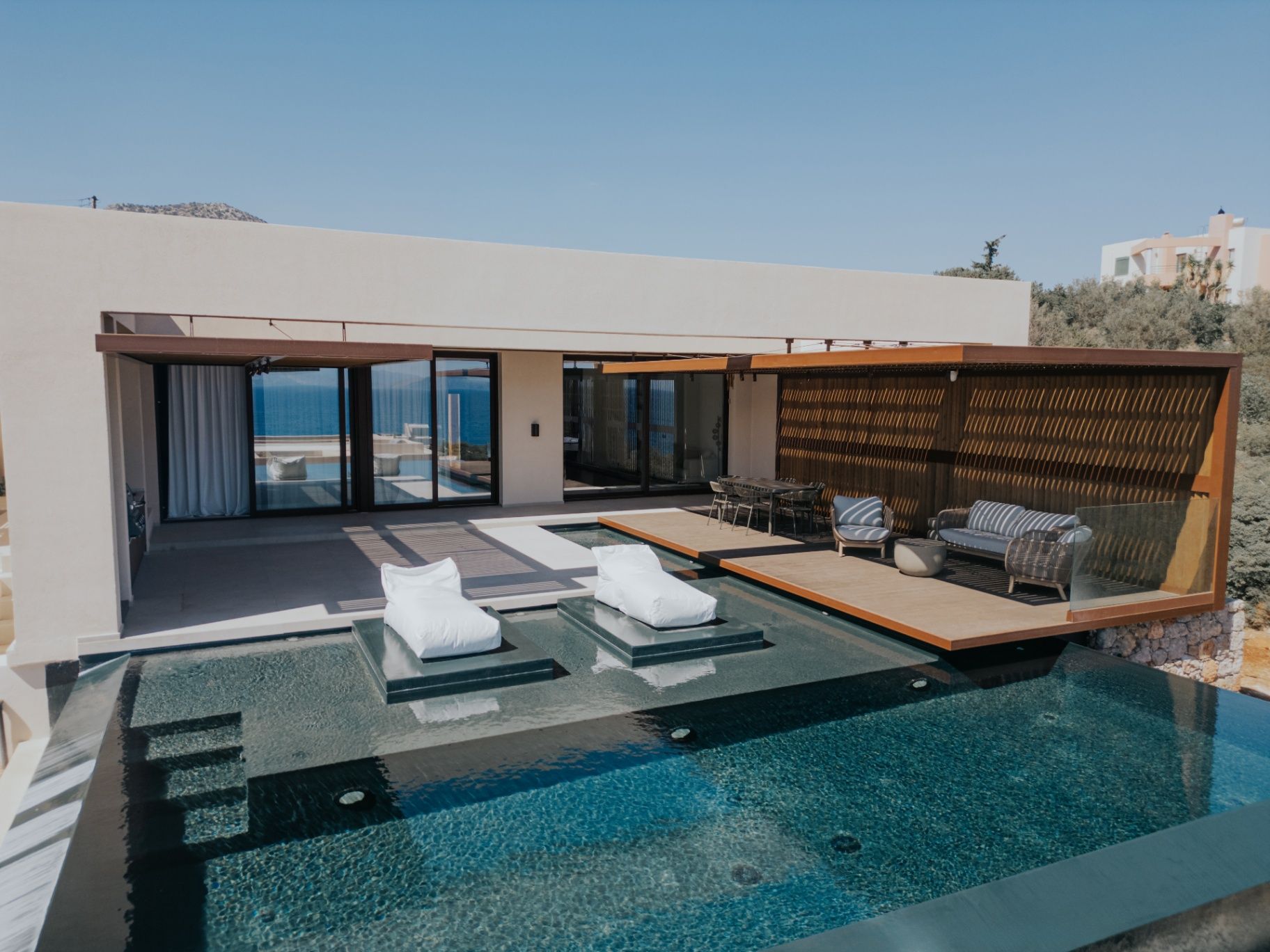 Private Blue villa in Ammoudara, Crete — infinity pool and terrace overlooking the Aegean